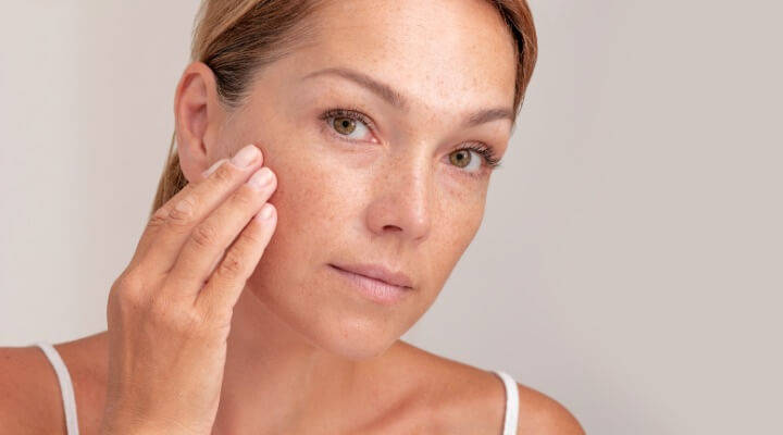 concerned woman touching face