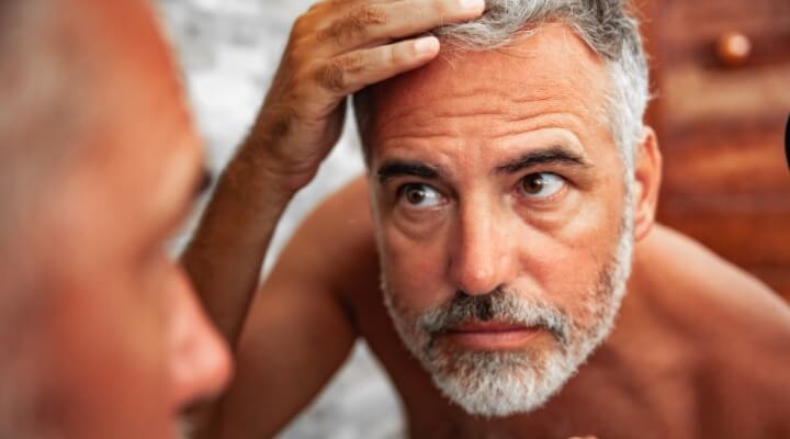 man looking at sunburn