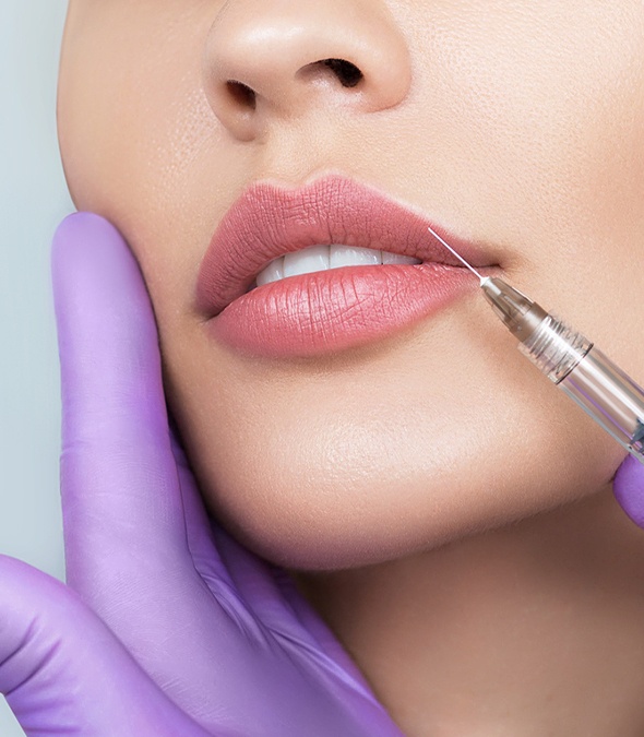 Dermatologist injecting a patient's lips