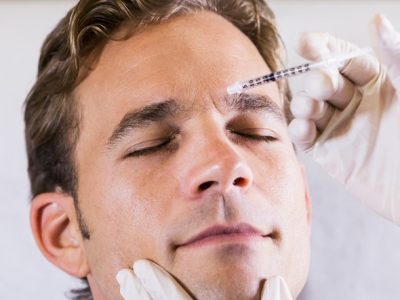 Dermatologist Injecting A Patient's Face With Wrinkle Relaxers