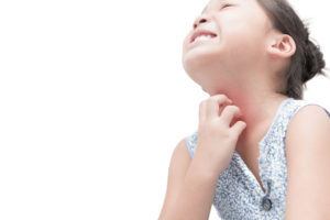 A girl scratching her eczema