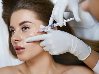 Dermatologist Injecting A Patient With Dermal Fillers